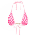 Pink checkered bikini top on a white background