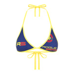 A blue and yellow bikini top with yellow ties and the text 'ROGUE' on the front on a white background.