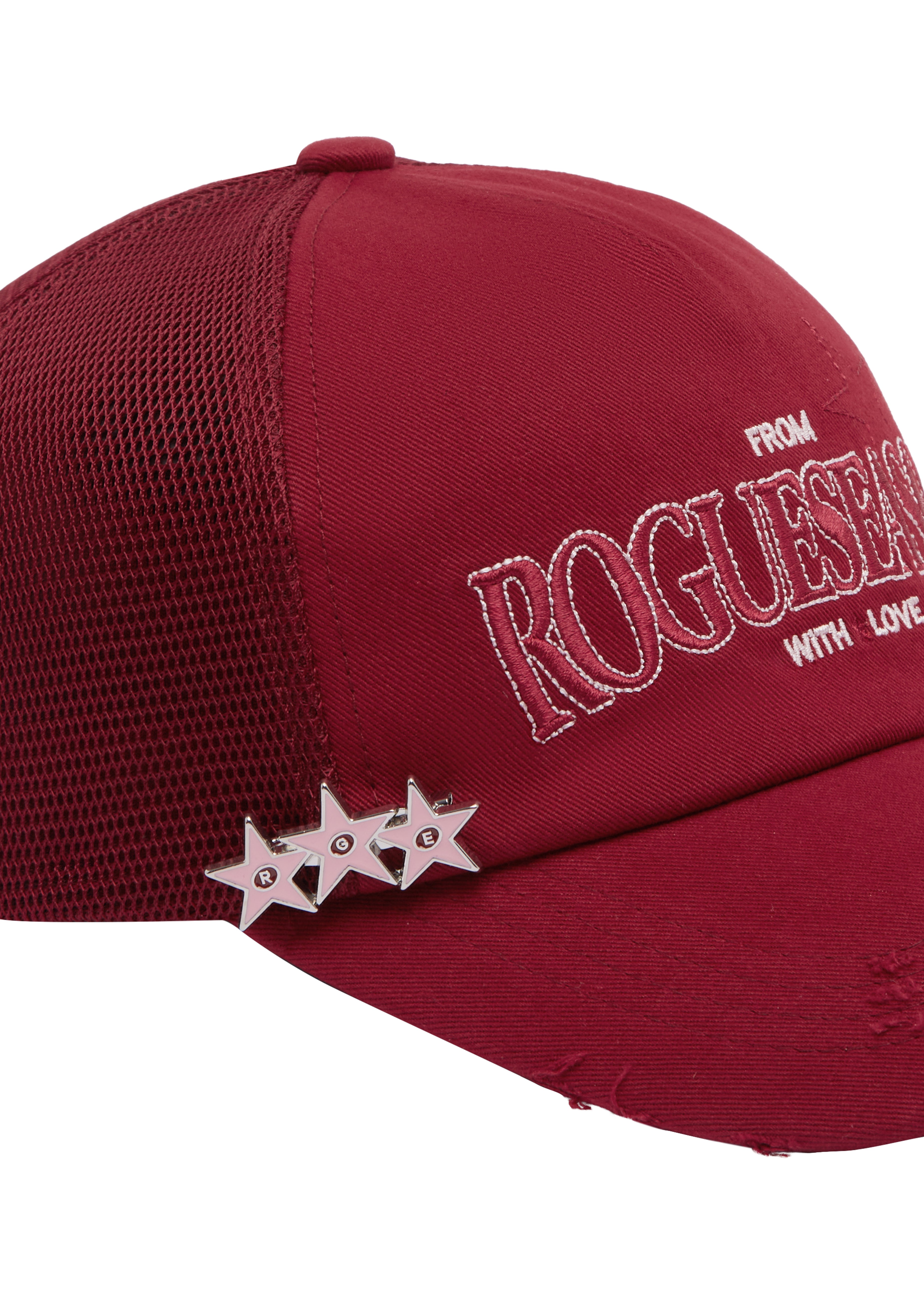 Close up detail shot of red cap with 'ROGUESEASON' branding and star design on a white background