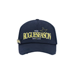 Navy blue cap with yellow text (ROGUESEASON) on a white background