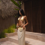 Model wearing a yellow bikini top and bottoms with a sheer maxi skirt in yellow