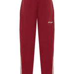 Cherry pants with yellow logo detailing on a white background