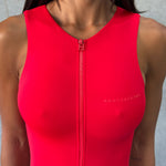 Close up shot of zipper detailing in a red swimsuit.