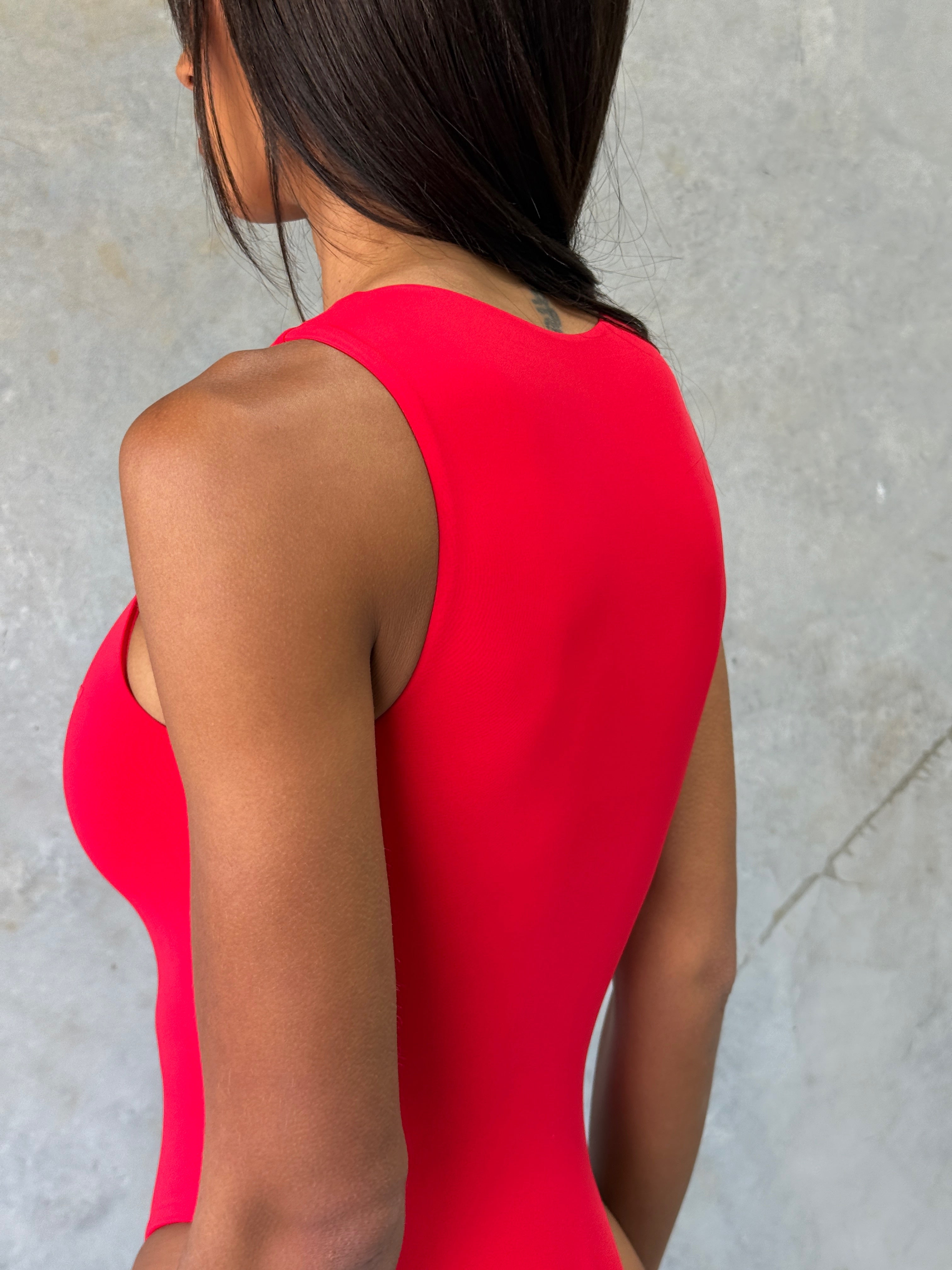 Close up shot of one piece swimsuit fabric being worn on model.