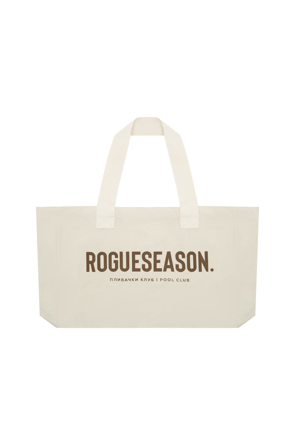 A beige canvas tote bag with 'ROGUESEASON' text and 'плибач клуб' printed on it in brown.