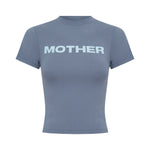 A short-sleeve t-shirt in a slate blue colour, featuring the word 'MOTHER' printed across the chest in a light baby blue font, displayed on a solid white background.