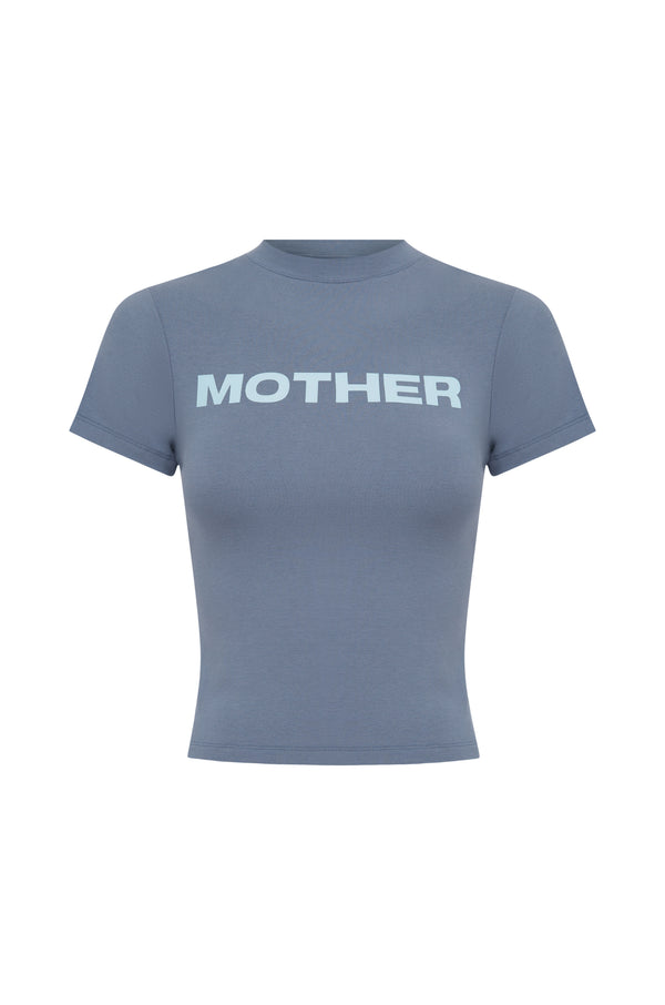 A short-sleeve t-shirt in a slate blue colour, featuring the word 'MOTHER' printed across the chest in a light baby blue font, displayed on a solid white background.